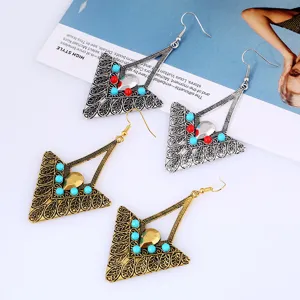 Detailed close-up view of retro ethnic geometric triangle alloy drop earrings with beads.