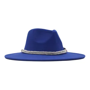 Detailed view of royal blue fedora hat with white rope band, elegant wool felt texture.