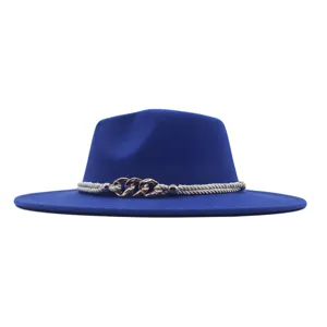Close-up detail of the royal blue wool fedora hat featuring a stylish metallic chain and braided rope.