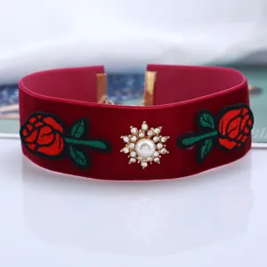Retro red velvet choker necklace with embroidered roses and pearl rhinestone centerpiece for women.