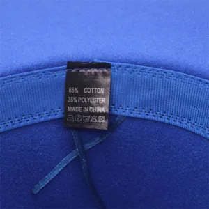 Detail view of the blue wool fedora hat interior washing label, showing 65 cotton 35 poly.