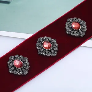 Vintage red velvet choker ribbon with ornate rhinestone flower crystal charms, elegant style.