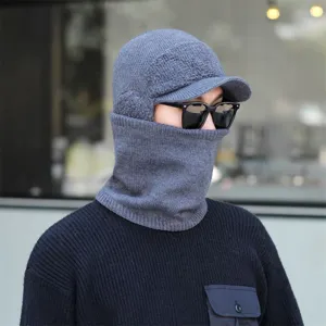 Detailed view of grey winter knitted hat with integrated neck warmer and warm fleece lining.