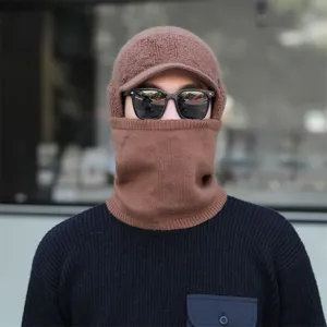 Detailed view of the winter fleece-lined knit balaclava cap in brown with visor and neck warmer.