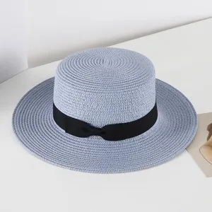 Light blue flat top straw hat with black ribbon bow, stylish summer sun beach hat for women.