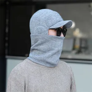 Detailed shot of winter knit hat with integrated neck warmer and visor for cold days.