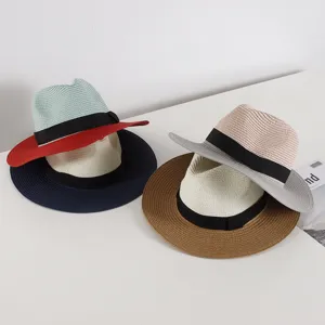 Detailed view of women's summer straw hat with wide brim, ribbon bow and stylish design.