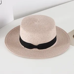 Korean style summer straw hat with black bow, flat top boater hat for women sun protection.