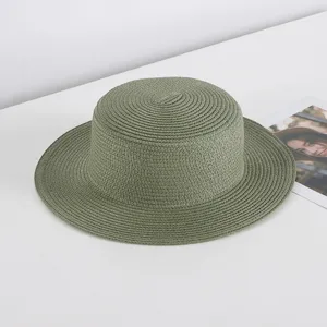Green straw hat detail shot, flat top wide brim sun hat, perfect for summer beach style.