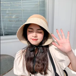 Stylish two-tone sun bucket hat for women, perfect for summer beach and outdoor UV protection.