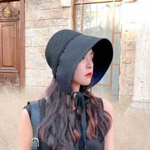 Stylish black sun hat for women, wide brim bucket hat with tie ribbon for beach and outdoor summer.