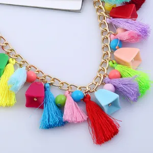 Bohemian multi-element colorful tassel necklace detail shot showcasing vibrant charms.