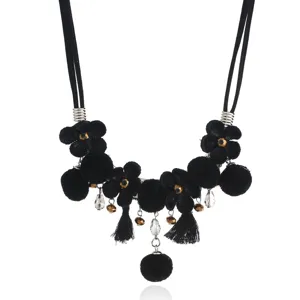 Black fabric flower pom-pom tassel statement necklace for women fashion jewelry detail.