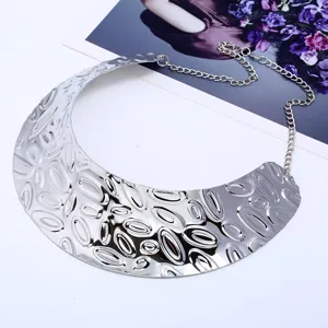 Exaggerated punk style metal bib necklace choker for women, statement silver jewelry detail.