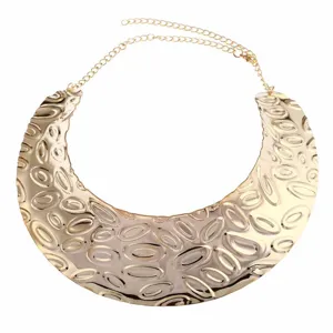 Gold chunky statement collar necklace with textured abstract oval pattern for women.