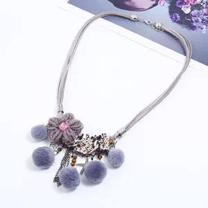 Boho grey pom pom knitted flower necklace with tassels, fashionable pendant jewelry for women.