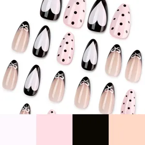 Press-on fake nails set with black heart, pink polka dots, and bow french nail art designs.
