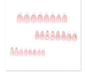 Short almond press-on nails with 3D floral design, pearls, and cute stars for summer style.