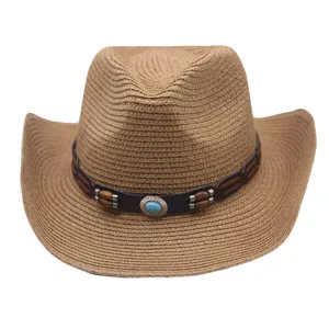 Close up of brown western straw hat with leather band and turquoise stone detail.