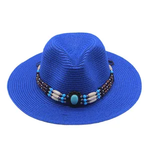 Cappello di paglia western blu dettaglio con perline turchesi, ideale per la protezione solare.