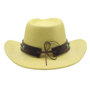 Detail view of a yellow glitter western cowboy hat with brown leather band and turquoise beads.