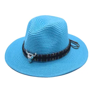 Blue straw fedora hat for summer beach, stylish ethnic ribbon band and metal bull skull decor.