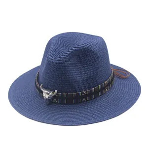 Blue straw fedora hat for summer beach sun protection with ethnic tribal band and metal bull skull decor.