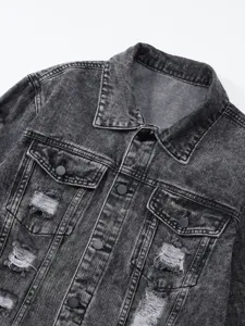 Close-up detail of dark grey acid wash distressed denim jacket collar and chest pockets.