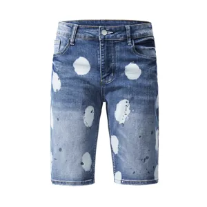 Men's summer ink splatter stretch denim shorts, trendy casual five-quarter pants detail.