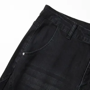 Vue de détail de jeans en denim extensible vintage lavé pour hommes, taille et poche.