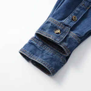 Detailed view of men's casual denim shirt long sleeve cuff with contrast stitching and buttons.