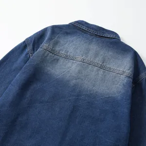 Denim shirt back detail view, classic washed blue fabric, premium stitching and collar.