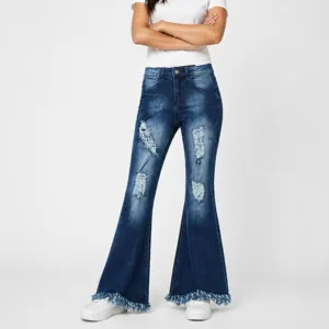 Detailed view of women's dark blue distressed flared jeans with frayed hems and stretch denim.