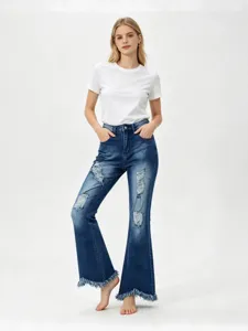 Women's blue flare ripped stretch denim jeans featuring raw frayed hem casual trousers