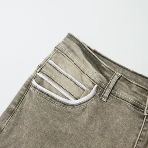 Close-up detail of men vintage wash stretch denim jeans pocket with white piping design.