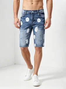 Men's blue paint splatter denim shorts, stylish slim fit five-point casual denim trousers.