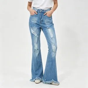 Distressed light blue stretch denim flare jeans with raw frayed hems and knee rips.