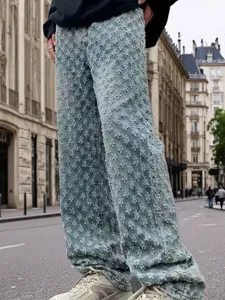 Men's American streetwear loose straight washed jeans with unique distressed textured design.