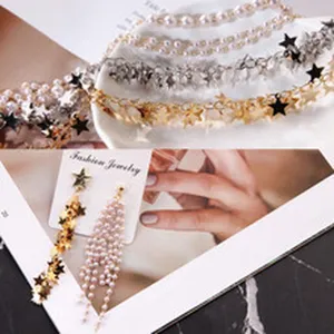 Meerlaagse parel- en sterrenketting en lange kwastoorbellenset, elegante mode sieraden set.