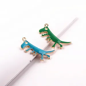 Cute cartoon dinosaur metal alloy charms in blue and green, ideal for DIY jewelry making.
