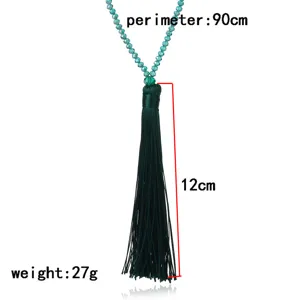 Green crystal bead tassel long sweater chain necklace, elegant fashion jewelry accessory.