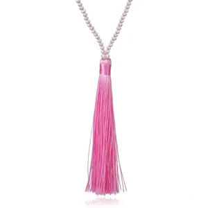 Pink crystal beaded long tassel sweater chain detail, elegant women fashion jewelry accessory.