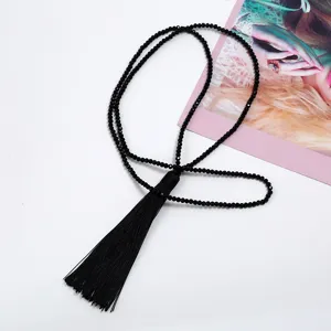 Long black beaded sweater chain with silk tassel, elegant fashion jewelry for women everyday wear.