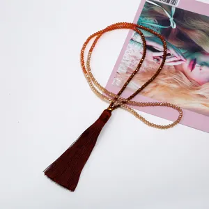 Long beaded crystal tassel sweater necklace for women, stylish gradient design accessory.