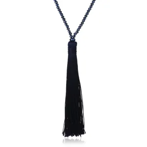 Dark blue crystal beaded tassel sweater necklace detail, elegant long fashion jewelry piece.