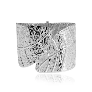 Wide silver metal leaf textured cuff bracelet detailed view showing intricate carved patterns.
