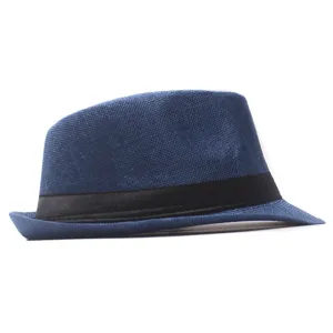 Detail view of the blue linen fedora hat with black band, showing texture and curved brim.