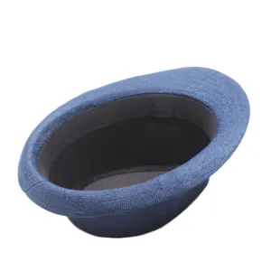 Detailed view of the blue straw fedora hat, showing the woven texture and inner band.