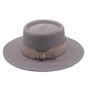 Closeup detail of the grey woven straw hat texture, elegant beige belt, and shiny metal buckle.