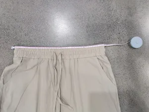 Men casual linen trousers waist measurement detail view, lightweight summer pants in khaki.